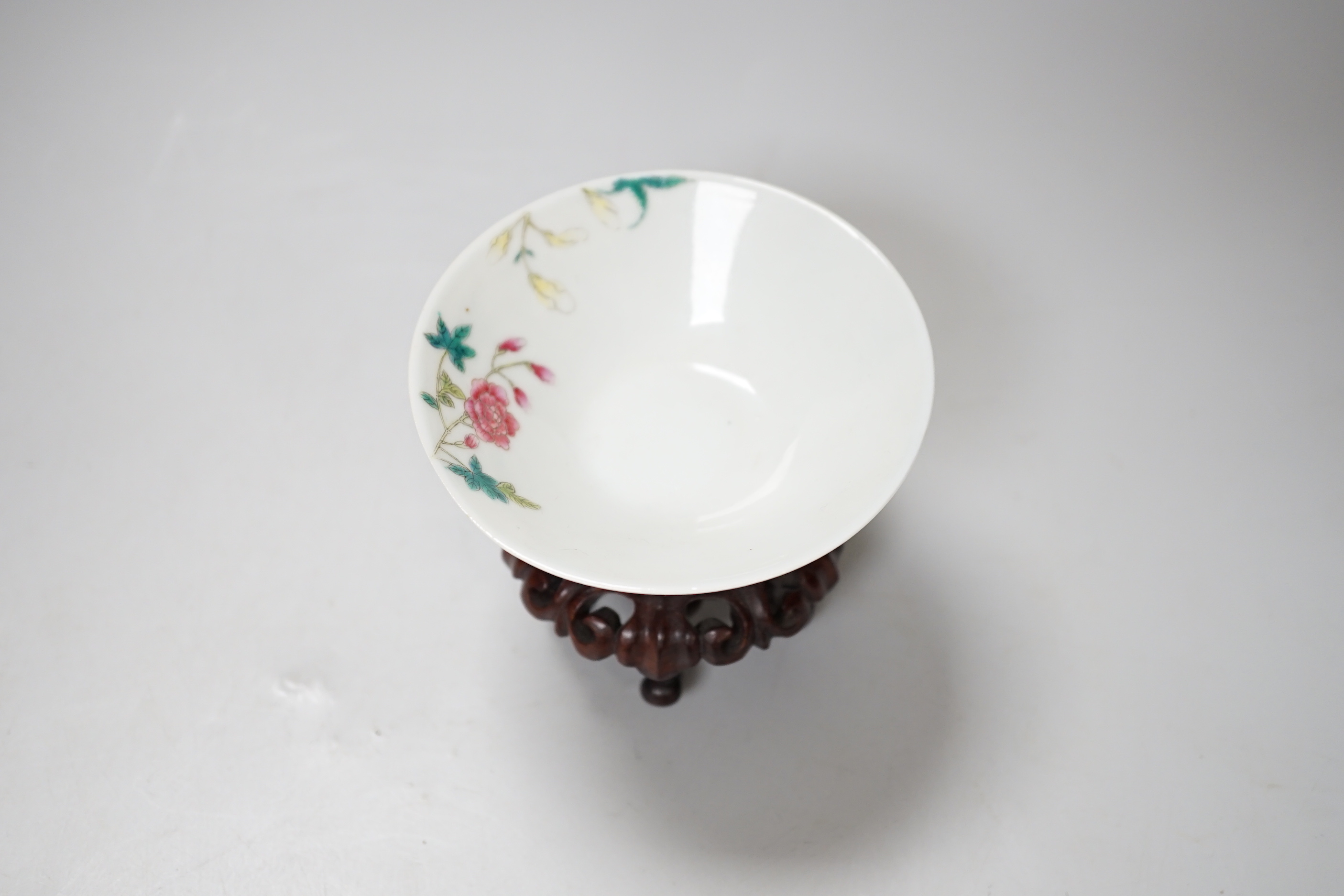 A Chinese famille rose conical bowl, Xuande mark but Republic period, wood stand 10cm diameter